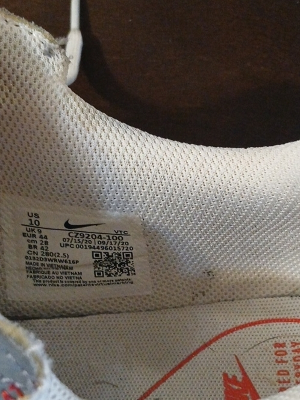 Nike White and Red Low-Top Athletic Sneaker